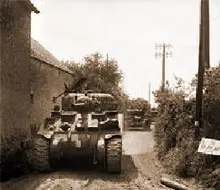 A Sherman of the Royal Armored Support Group on the way to Tilly-sur-Seulles on June 13.